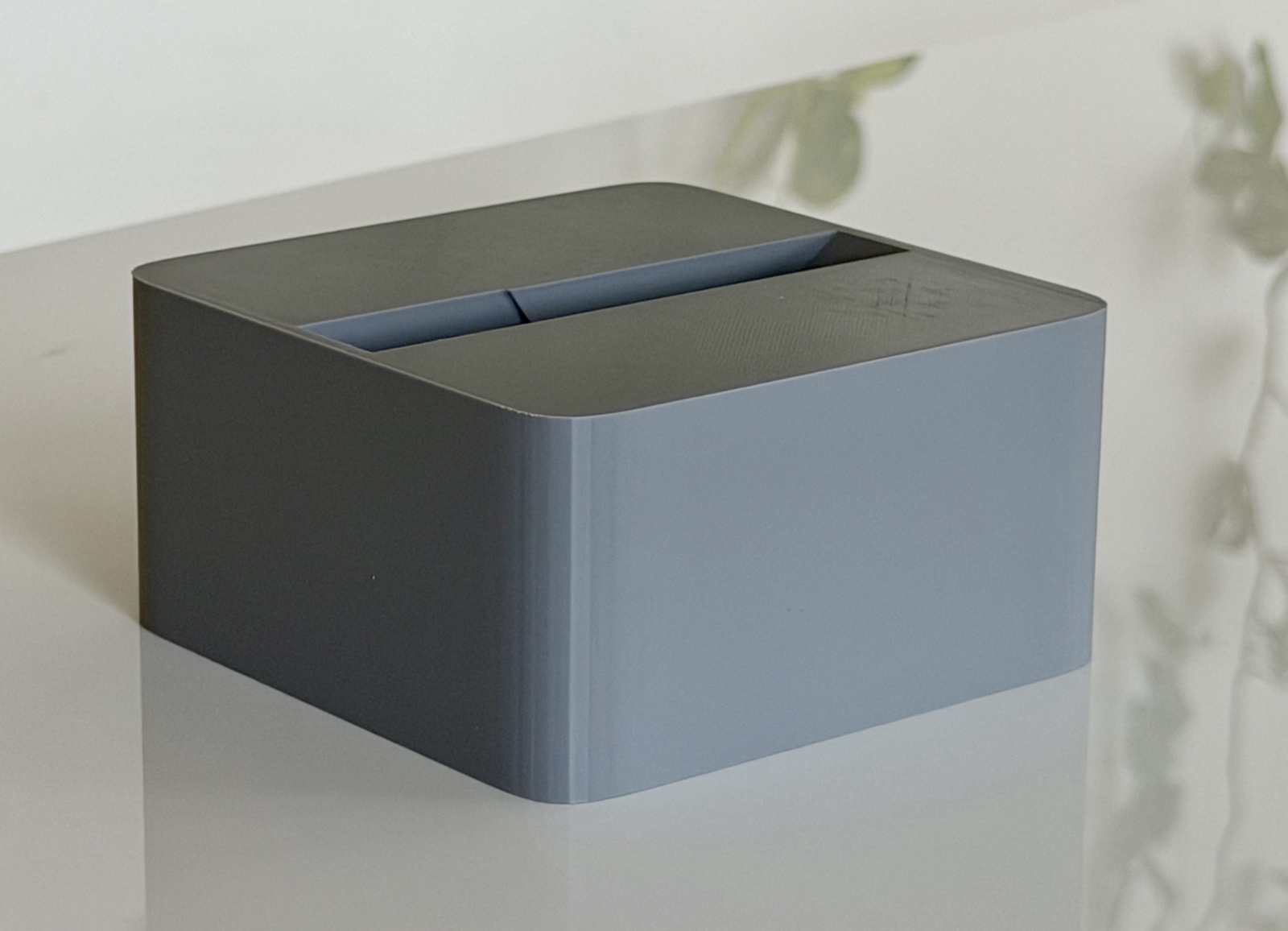 Top-down three-quarter view of a Cubistand showing the laptop slot from above